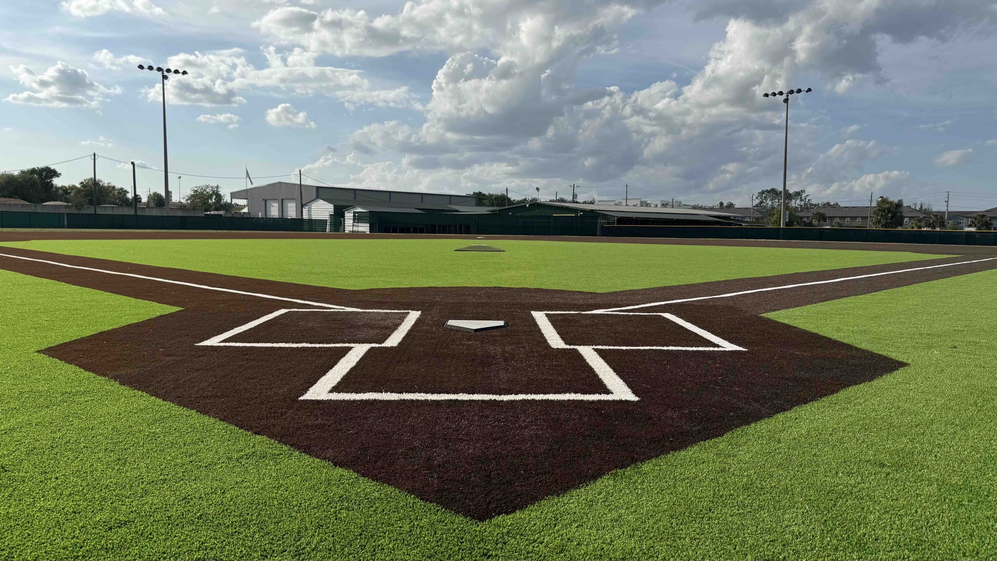 Finished artificial turf baseball field seen from behind home plate